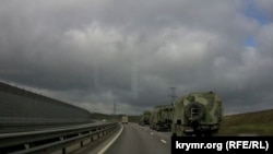 A convoy of Russian military equipment is seen on the move in Crimea on March 24.