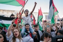 Members of the Palestinian community and their supporters rally in solidarity with Palestinians in the Gaza Strip organized by the Palestinian Embassy in Bucharest on October 21.