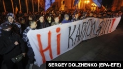 "No capitulation!": Far-right activists protest against Ukraine agreeing to the so-called Steinmeier Formula near of the president's office in Kyiv on October 1.