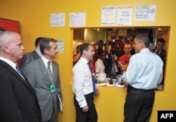 Russian President Dmitry Medvedev (center) and U.S. President Barack Obama chat while ordering lunch at Ray's Hell Burger in June 2010 in Arlington, Virginia.