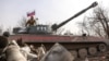 A serviceman of the so-called Luhansk People’s Republic militia atop a self-propelled howitzer in eastern Ukraine on March 29. 