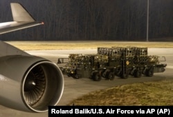 Western military equipment is loaded on to a plane for delivery to Ukraine.