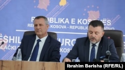 Kosovo's top prosecutor Blerim Isufaj (left) and Naim Abazi (right), who is the prosecutor of the Banjska attack case, address the media on September 11.