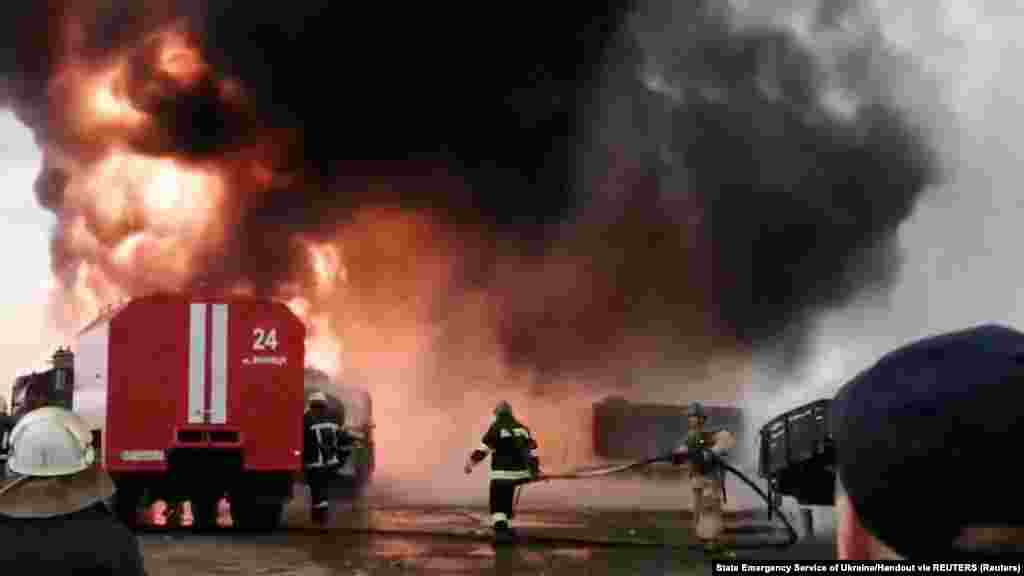 First responders work at the scene after a Russian missile hit a building at Havryshivka Vinnytsya International Airport in Vinnytsya on March 6.