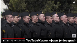 A screengrab showing Sergei Grudinin (third from right) in a video released on April 16 by Russia's Defense Ministry.