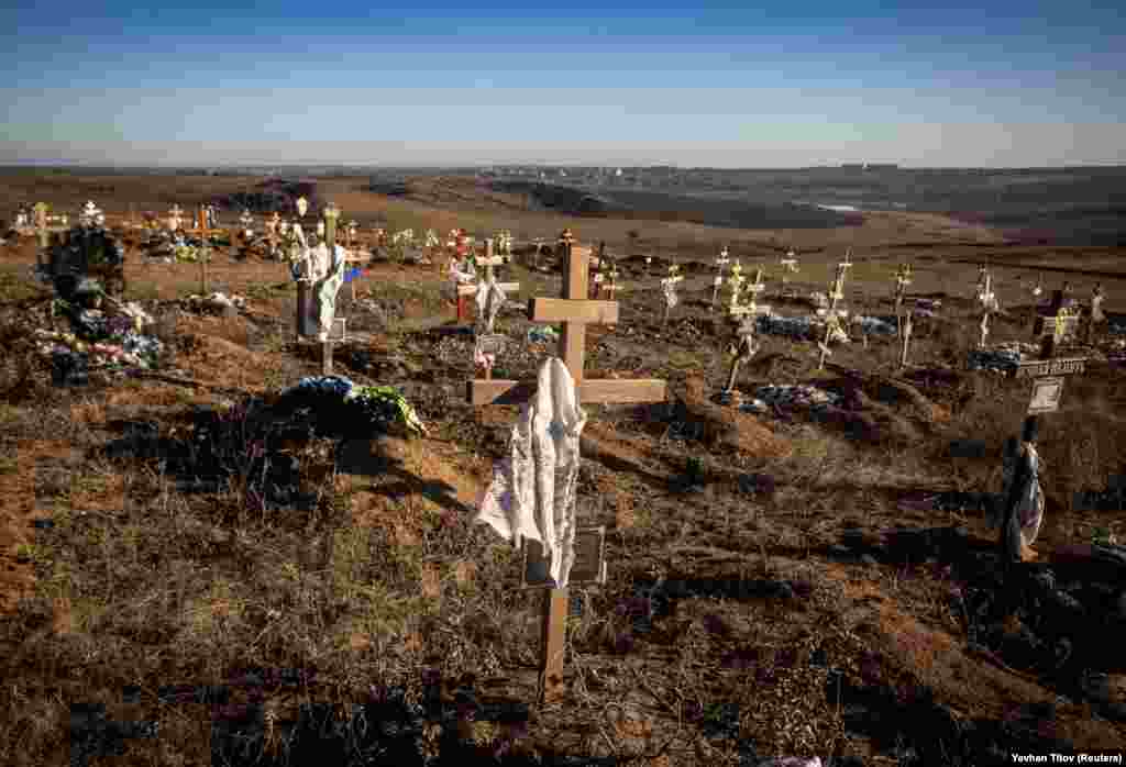 New graves are seen at a cemetery near Bakhmut. Neither Ukraine nor Russia has said how many have been killed during the fighting for Bakhmut.