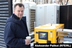 Tymofiy Mylovanov shows the industrial generator powering the Kyiv School of Economics throughout the blackouts.