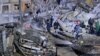 Rescuers and residents continued the search for people buried under the rubble into the evening on January 14 after a Russian missile strike hit an apartment building in the Ukrainian city of Dnipro earlier in the day.