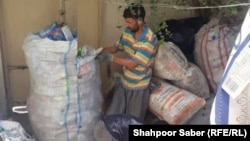 A former Afghan special-forces commander collects garbage in Iran in 2022 after fleeing Afghanistan.