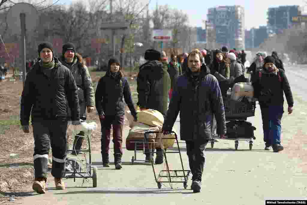 Citizens prepare for an attempt to evacuate the embattled city of Mariupol on foot on March 20.