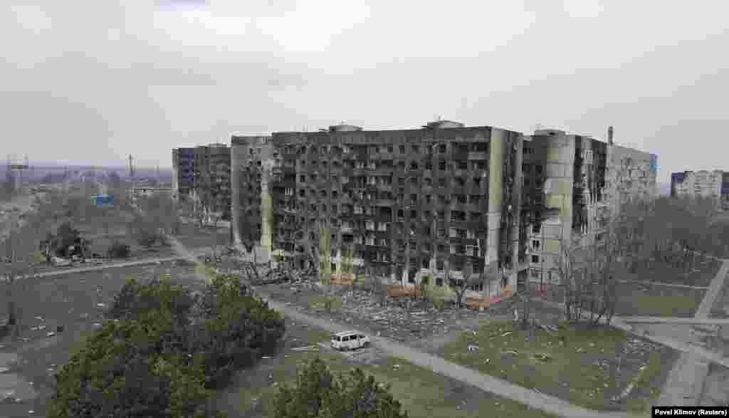 An aerial view of damaged apartment buildings..