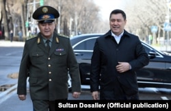 President Sadyr Japarov (right) and national-security chief Kamchybek Tashiev (file photo)