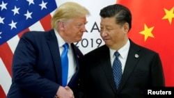 U.S. President Donald Trump meets Chinese leader Xi Jinping at a G20 summit in Japan in 2019. 