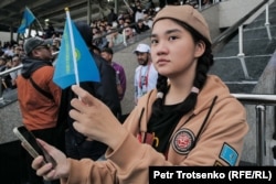 A Kazakh volunteer displays her national pride at the games in Astana.