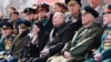 Russian President Vladimir Putin (center) watches a military parade marking the 77th anniversary of the Soviet Union's contribution to victory over Nazi Germany in World War II, in Red Square on May 9.