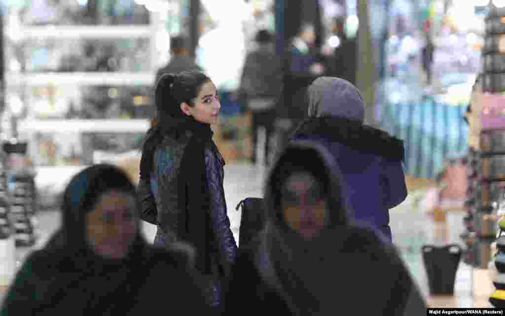 A woman in a market in Tehran on December 5.&nbsp; Iran has been rocked by months of protests that erupted in September following the death of Kurdish-Iranian woman Mahsa Amini, who was detained by Tehran&#39;s morality police. Amini was flagged for tight trousers and for wearing her hijab &quot;improperly.&quot;&nbsp;