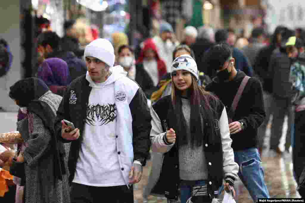 A couple in Tehran on December 6.&nbsp; A video published in early December shows two women walking down one of Tehran&#39;s central streets with their hair uncovered, a scene that was widely shared at the time but which now appears to be relatively common.&nbsp; &nbsp;