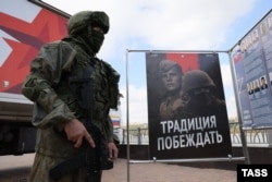 A soldier stands outside a mobile Russian Army recruitment office in Rostov-on-Don, Russia, in September 2022.