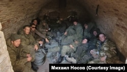 A group of Russian soldiers who refused to take part in hostilities are pictured in a cellar in Ukraine's Donetsk region in December 2022.