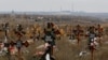 Rows of fresh graves multiplied as Russian forces pressed to capture the strategic Azov Sea port city of Mariupol in early 2022. 