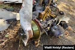 The engine and broken wooden propeller of a Shahed-136 drone was found after a strike on fuel-storage facilities in Kharkiv on October 6.