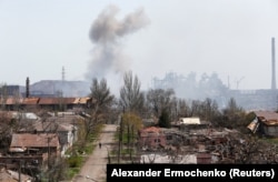 A puff of smoke from fighting rises above Mariupol’s Azovstal iron- and steelworks on April 18, nearly two months into Russia's invasion of Ukraine.