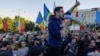 George Simion, leader of the far-right Alliance for the Unification of Romania, pictured leading a protest in 2022, falsely claimed on October 17 that Romania had evacuated 3,000 Ukrainians from Israel but "no Romanians," in a social media post that went viral.