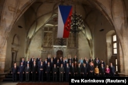 Attendees pose for a photograph at the Informal EU 27 Summit and Meeting within the European Political Community at Prague Castle.