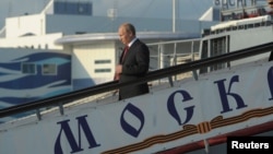 Vladimir Putin disembarks after paying a visit in 2014 to the Moskva missile cruiser, the flagship of Russia's Black Sea fleet, which sank on April 14.