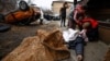 Serhiy Lahovskiy mourns over the body of his friend, Ihor Lytvynenko, who local residents say was killed by Russian soldiers, in Bucha on April 5.