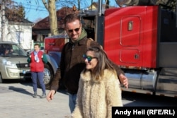 Gulyas poses for a fan photo as the crew starts to break down the truck to move the monthlong road show to its final stop, near Lake Balaton.