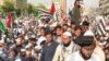 Supporters of the Pakistan Democratic Movement protest in the port city of Karachi against price hikes of petroleum, electricity, and daily commodities on October 23.