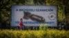 In Budapest on October 18, a man passes by a poster depicting a bomb, with the text, "We are being punished by the Brussels sanctions."