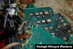 Ukraine's military displays circuit boards from a Kalibr missile used by Russian forces that a Ukrainian munitions expert said did not explode on impact in the Kharkiv region in October 2022.