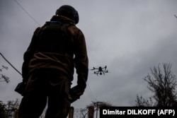 A Ukrainian soldier launches a drone in eastern Ukraine's Donetsk region on October 30.