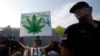 A demonstrator holds a banner that reads, "Our plant -- our medicament" during a protest to legalize cannabis in Belgrade.