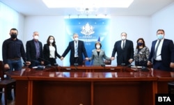 Bulgarian Health Minister Stoycho Katsarov (fourth from left) and the heads of professional medical groups present a united front against COVID-19 on November 2.