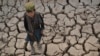 A child walks over parched land in the Bala Murghab district of Badghis Province on October 15. 