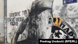 The defaced mural of Ratko Mladic was quickly restored by hooded youths who described themselves as being "from the neighborhood."