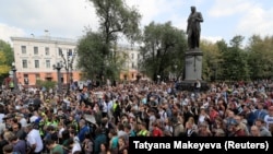 People attend a rally to demand that opposition candidates be allowed to run in upcoming local elections in Moscow in August 2019.