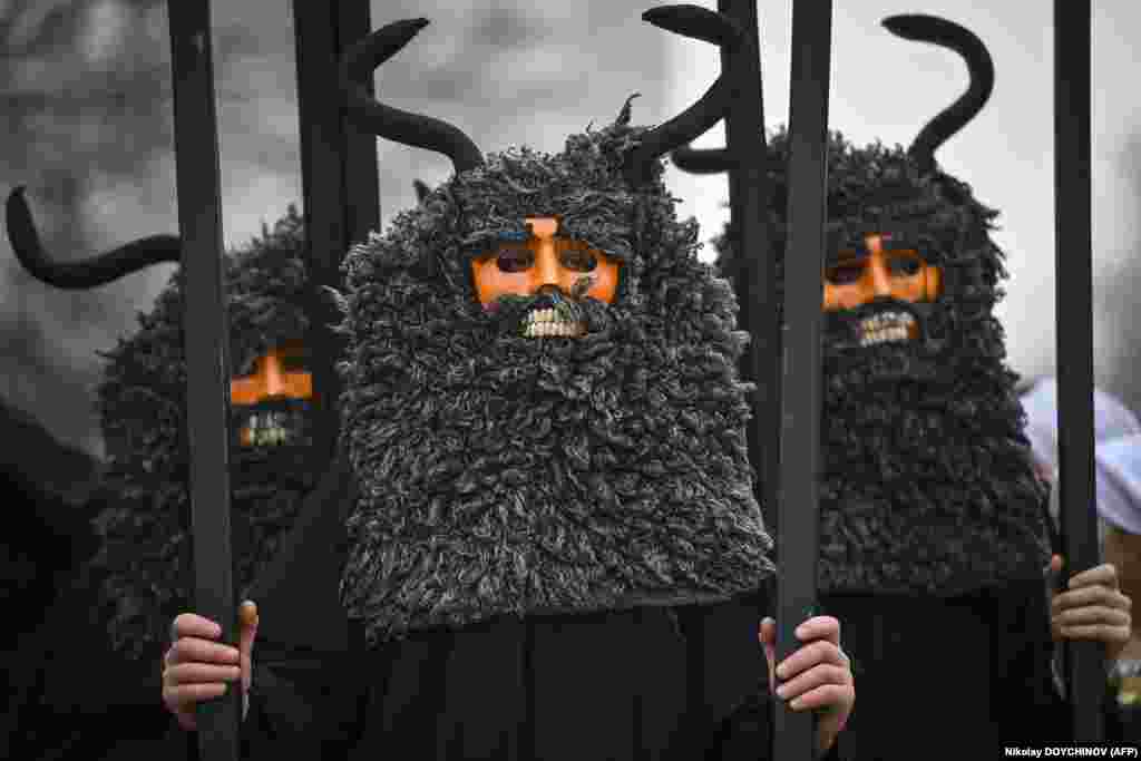 Masked dancers, known as Kukeri, perform during the International Festival of Masquerade Games in Pernik, Bulgaria, on January 28.