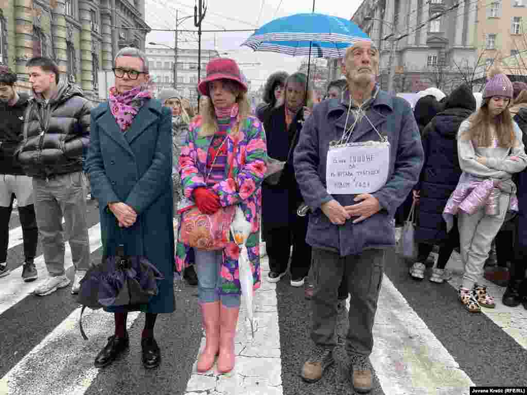 Protesters marked 15 minutes of silence to remember each person killed in the railway station collapse.