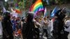 Police escort participants during the LGBT Pride march in Chisinau in June 2022. 