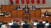 Kyrgyz President Sadyr Japarov peaks in parliament in June.