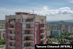 Standing on top of 16 floors, this St. Nino's cross overlooks the district of Gldani.