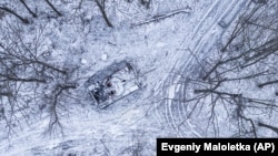 A damaged Russian tank in a forest in the Kharkiv region, northeastern Ukraine