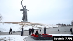 Russian President Vladimir Putin (center) visits the Mamayev Kurgan World War II Memorial complex in Volgograd on February 2.