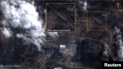 A satellite image with overlaid graphics shows military vehicles alongside the Chernobyl nuclear power plant on February 25.