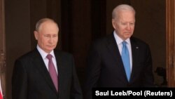 U.S. President Joe Biden (right) and Russian President Vladimir Putin arrive for a summit in Geneva on June 16, 2021.