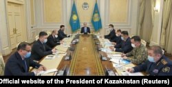 Kazakh President Qasym-Zhomart Toqaev (center) chairs a meeting of the emergency operations center in Nur-Sultan following mass protests triggered by the fuel price increase in January.